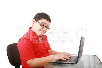 young boy with computer isolated on white