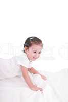 cute little girl on the bed at home