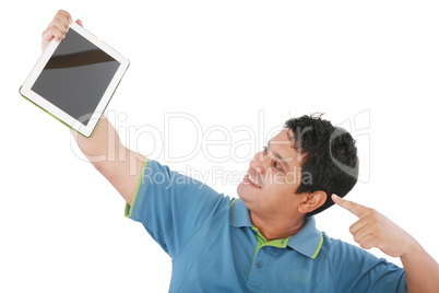 Laughing casual young man holding a touch pad tablet pc on isola