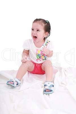 Portrait of emotionally kid. Funny little girl isolated on white