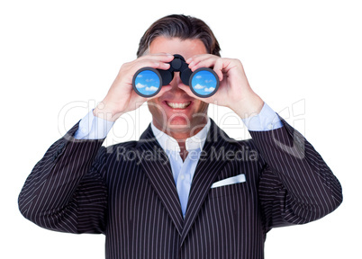 Smiling businessman using binoculars