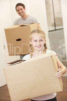 Girl with young man on moving day carrying cardboard box