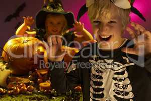 Halloween party with children wearing scaring costumes