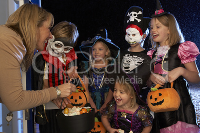 Happy Halloween party with children trick or treating