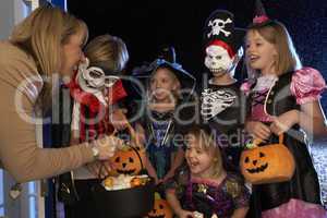 Happy Halloween party with children trick or treating