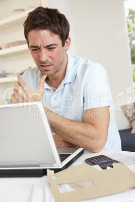 Young man working with laptop computer