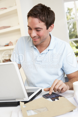 Young man working with laptop computer