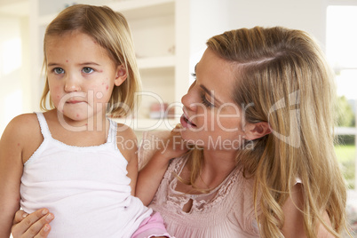 Mother nursing sick child