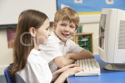 Schoolchildren In IT Class Using Computer