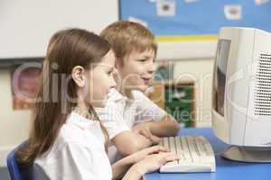 Schoolchildren In IT Class Using Computer