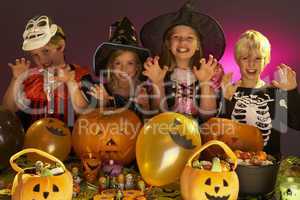 Halloween party with children wearing fancy costumes