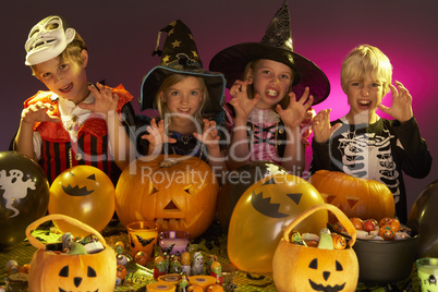 Halloween party with children wearing fancy costumes