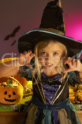 Halloween party with a child wearing scaring costume