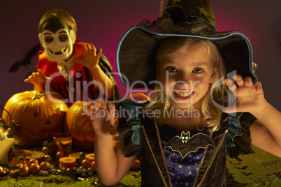 Halloween party with children wearing scaring costumes