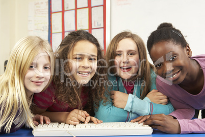 Group Of Schoolgirls In IT Class Using Computer