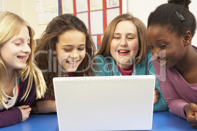 Group Of Schoolgirls In IT Class Using Computer