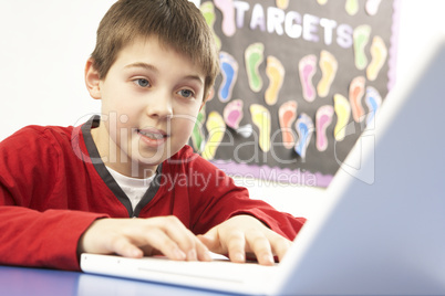 Schoolboy In IT Class Using Computer