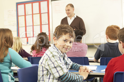 Schoolchildren Studying In Classroom With Teacher