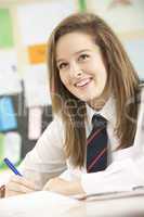 Female Teenage Student Studying In Classroom