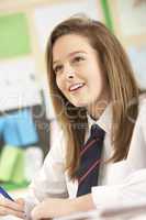 Female Teenage Student Studying In Classroom