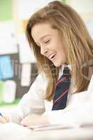 Female Teenage Student Studying In Classroom