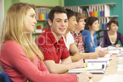 Teenage Students Studying In Classroom