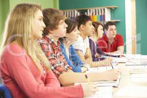 Teenage Students Studying In Classroom