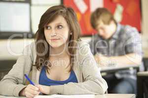 Female Teenage Student Studying In Classroom