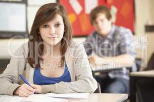 Female Teenage Student Studying In Classroom