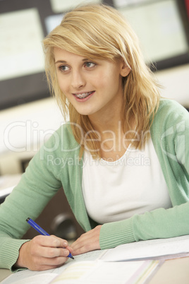 Female Teenage Student Studying In Classroom