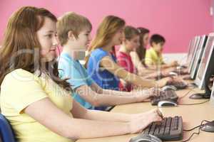 Teenage Students In IT Class Using Computers In Classroom