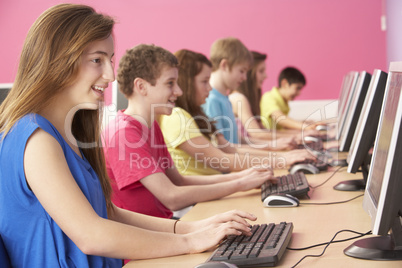 Teenage Students In IT Class Using Computers In Classroom