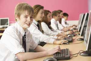 Teenage Students In IT Class Using Computers In Classroom