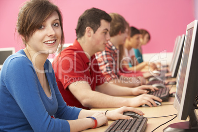 Teenage Students In IT Class Using Computers In Classroom
