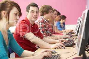 Teenage Students In IT Class Using Computers In Classroom