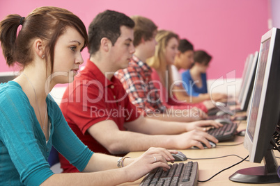 Teenage Students In IT Class Using Computers In Classroom