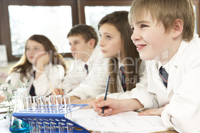 Group Of Teenage Students In Science Class