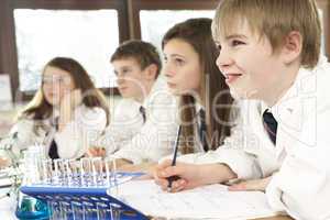 Group Of Teenage Students In Science Class