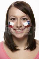 Young Female Sports Fan With Chilean Flag Painted On Face