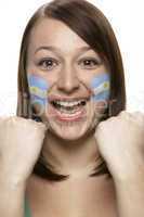 Young Female Sports Fan With Argentinian Flag Painted On Face