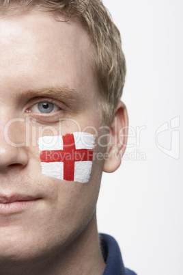 Young Male Sports Fan With St Georges Flag Painted On Face