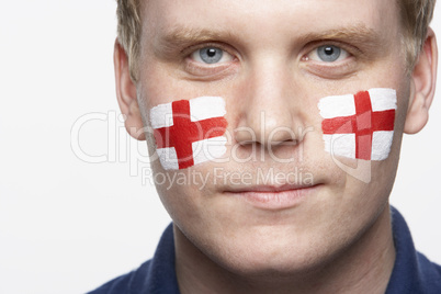Young Male Sports Fan With St Georges Flag Painted On Face