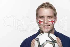 Young Male Football Fan With St Georges Flag Painted On Face