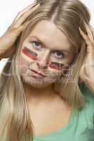 Disappointed Young Female Sports Fan With German Flag Painted On