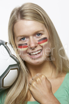 Young Female Sports Fan With German Flag Painted On Face