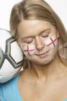 Young Female Football Fan With St Georges Flag Painted On Face