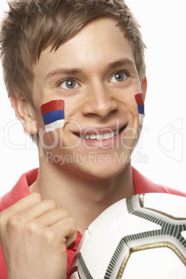Young Male Football Fan With Serbian Flag Painted On Face