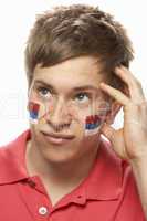 Disappointed Young Male Sports Fan With Serbian Flag Painted On