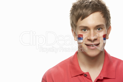 Young Male Sports Fan With Serbian Flag Painted On Face
