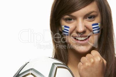 Young Female Football Fan With Uruguayan Flag Painted On Face
